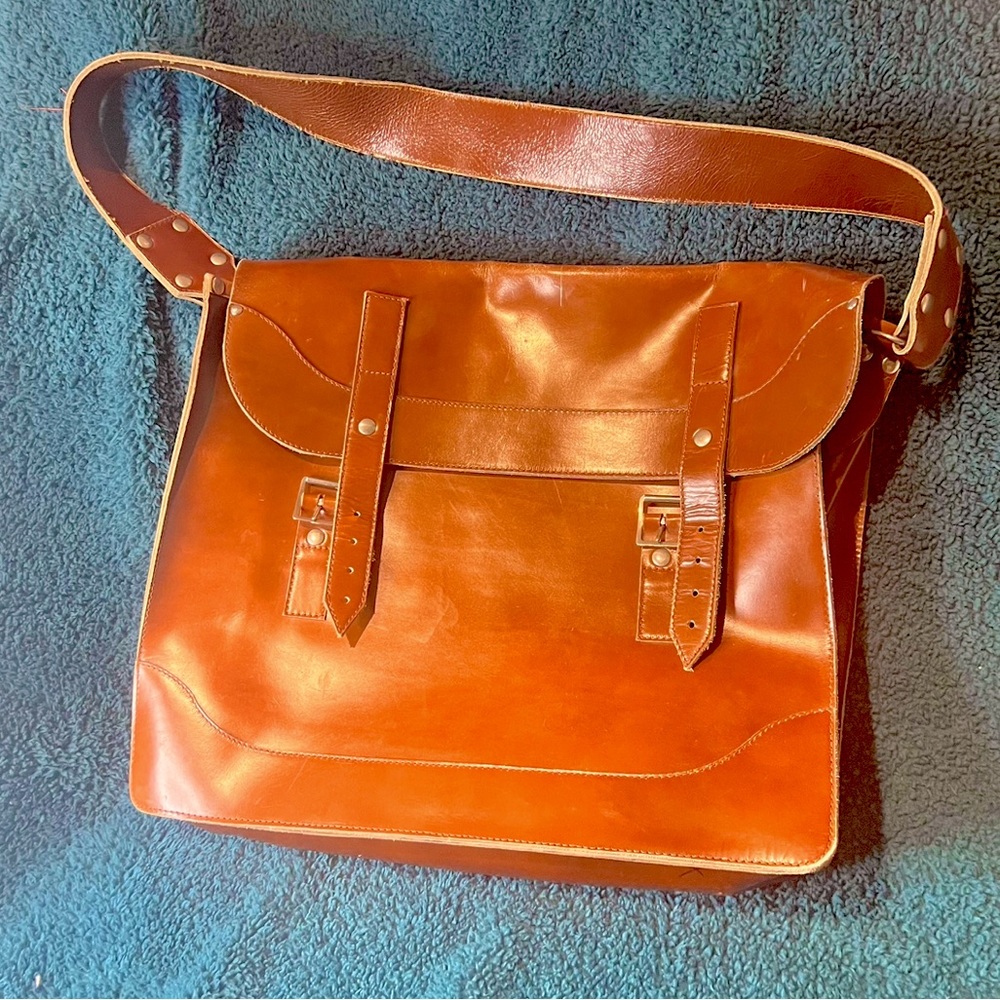 A light to medium brown vintage messenger bag, real leather, lightly loved